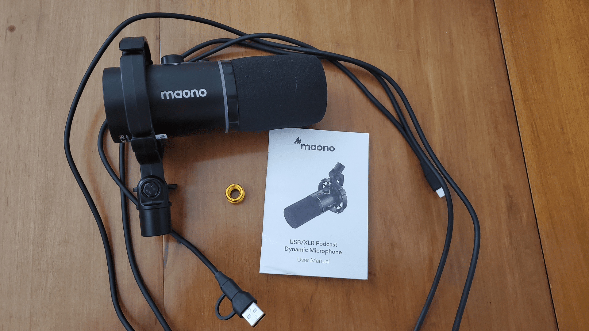 The complete contents of the box. Note the changeable ended cable and adapter screw, plusses, and the lack of any sort of stand or mount, a minus.
