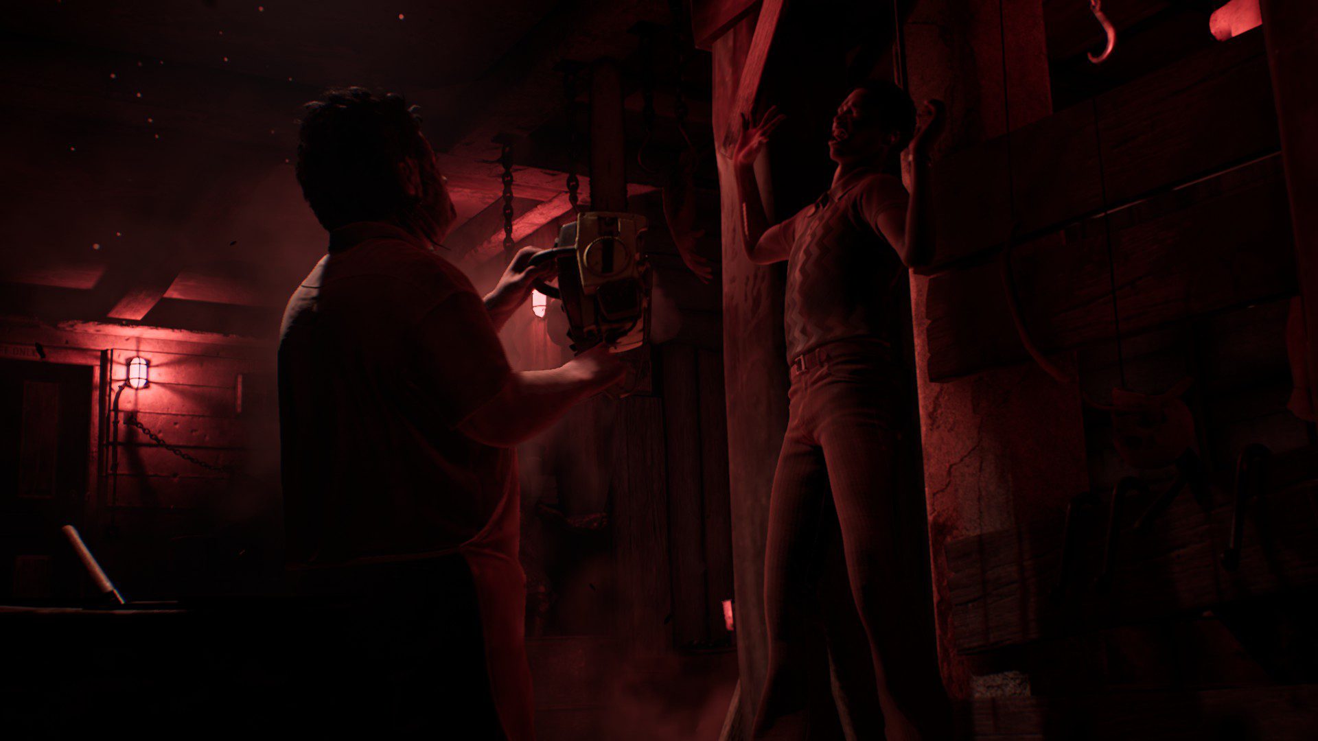 Leatherface preparing to saw through a character with some red lights providing an ominous vibe