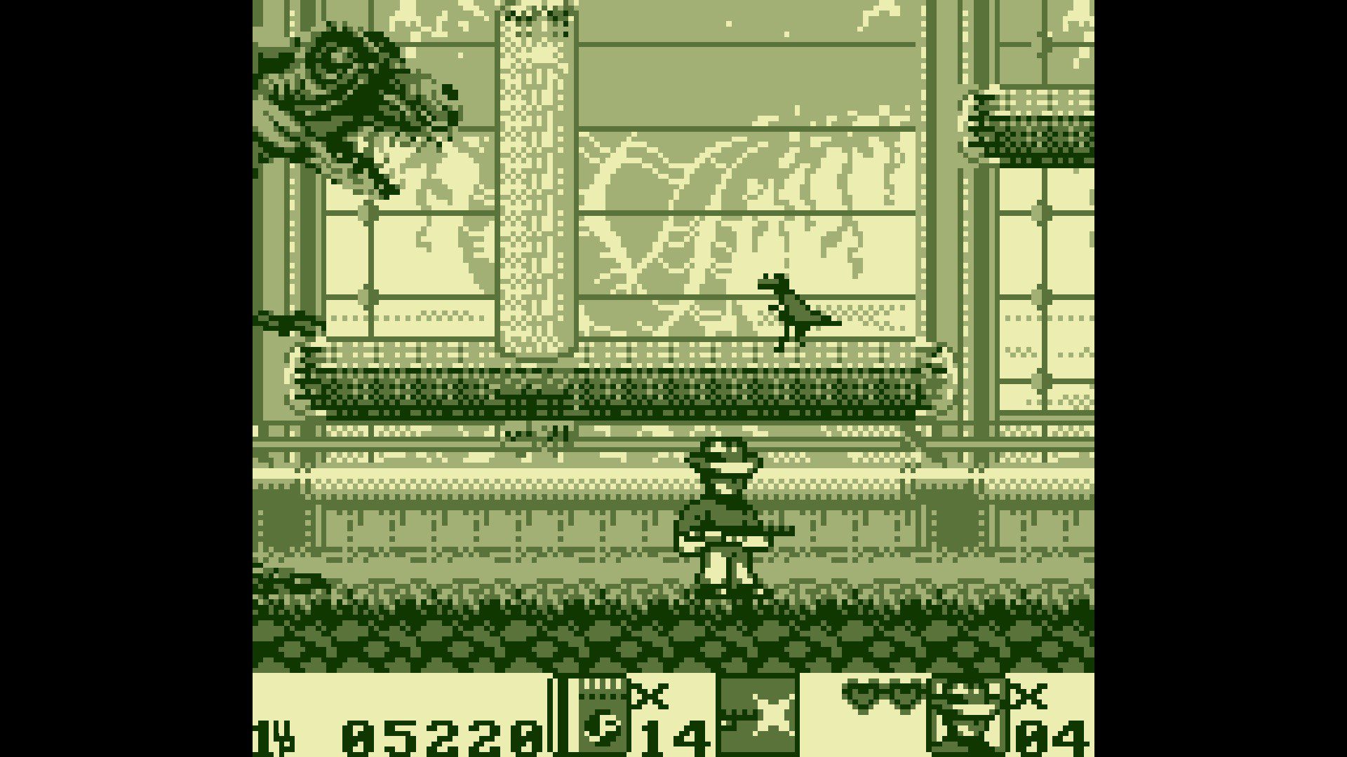 Jurassic Park Part 2: The Chaos Continues for the Gameboy. Screenshot of the autoscroller level with a t-rex chasing the player character from the left as they have to jump and collect keycards to unlock doors.