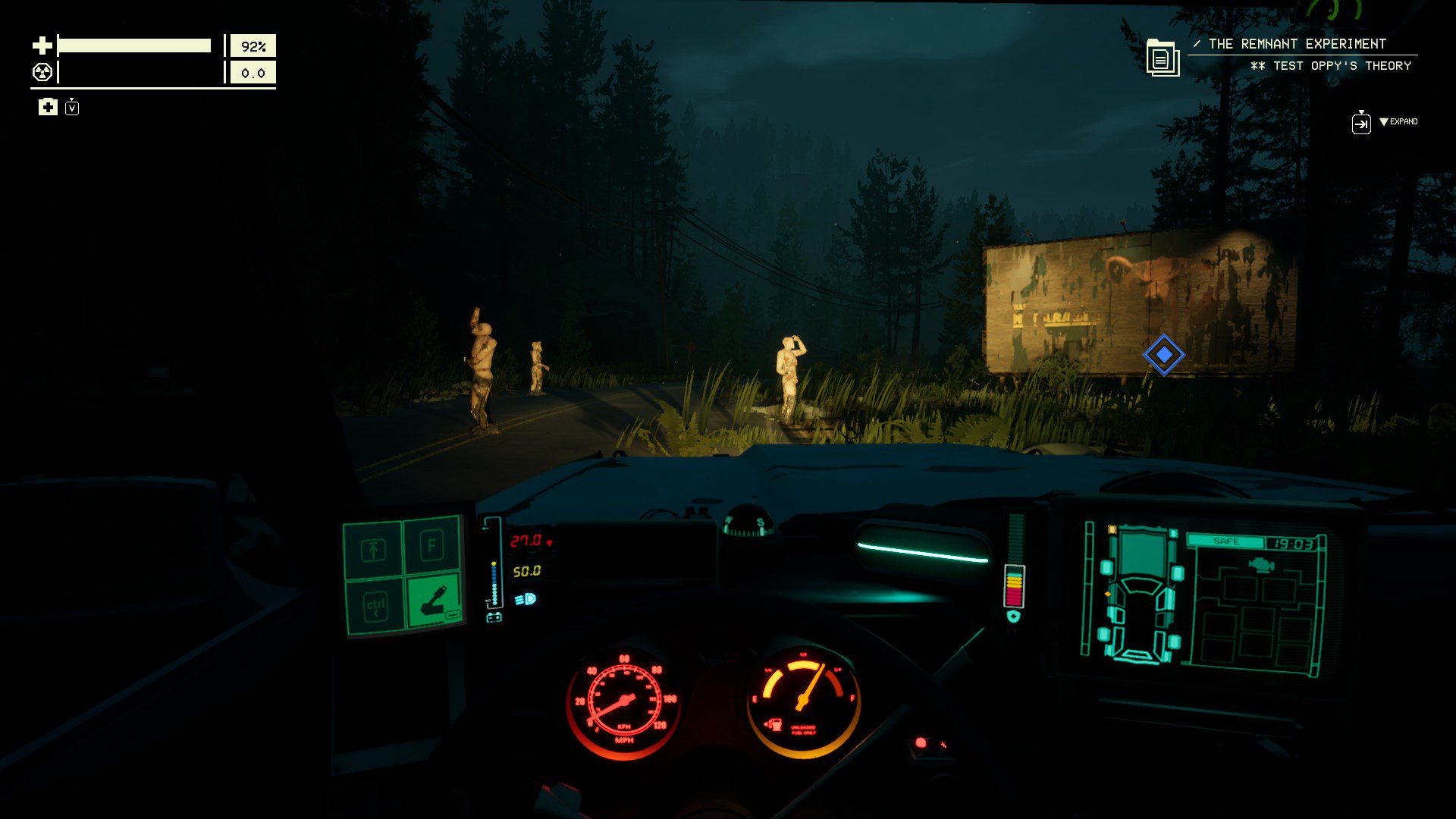A few manequins standing by a destroyed welcome sign