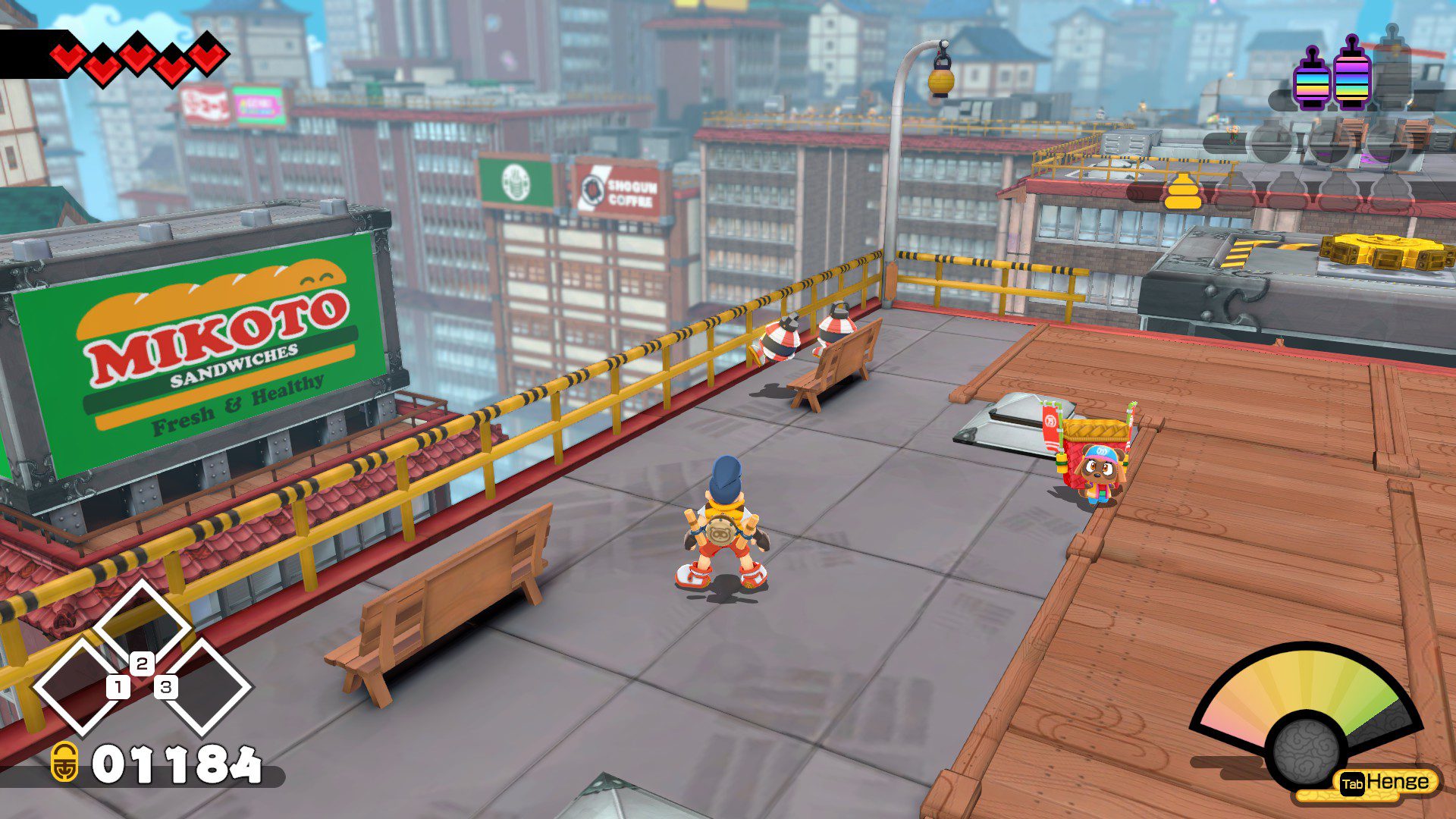 A view across the different roofs of apartment buildings, with barriers on their edges