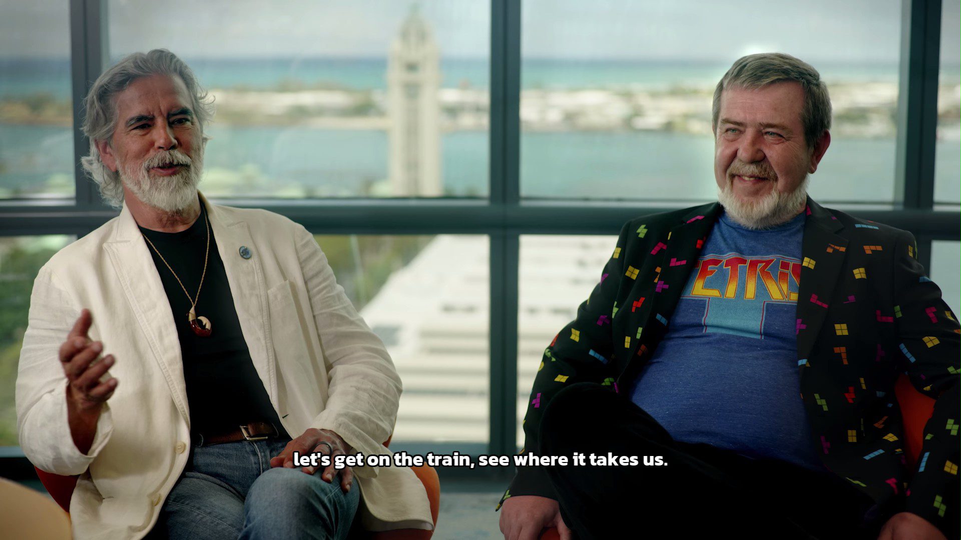 Henk Rogers and Alexey Pajitnov discussing a trip they went on together once upon a time