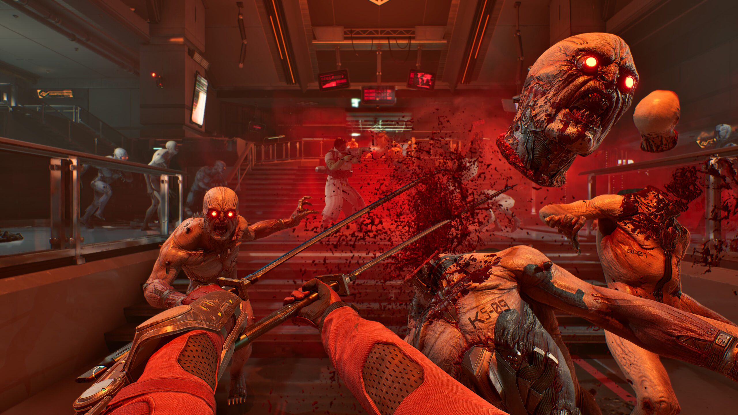 Killing Floor 3 video game screenshot slash attack as monster head gets cut off by a saw-like weapon