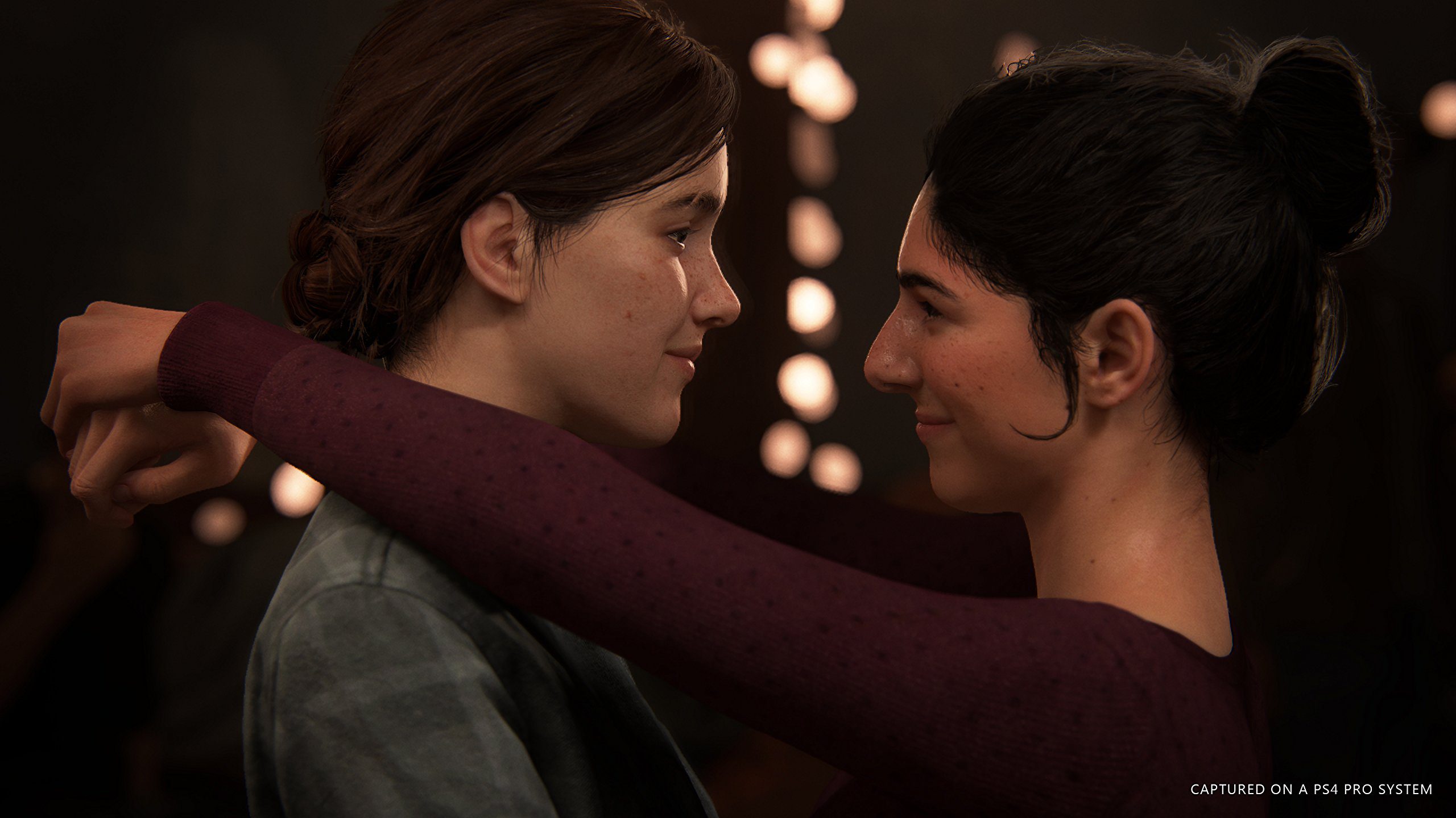 Ellie (left) slow dancing with her love interest Dina (right) at a party in Jackson