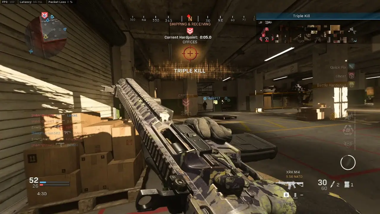 Player aiming an XRK M4 in a Call of Duty Modern Warfare game match.