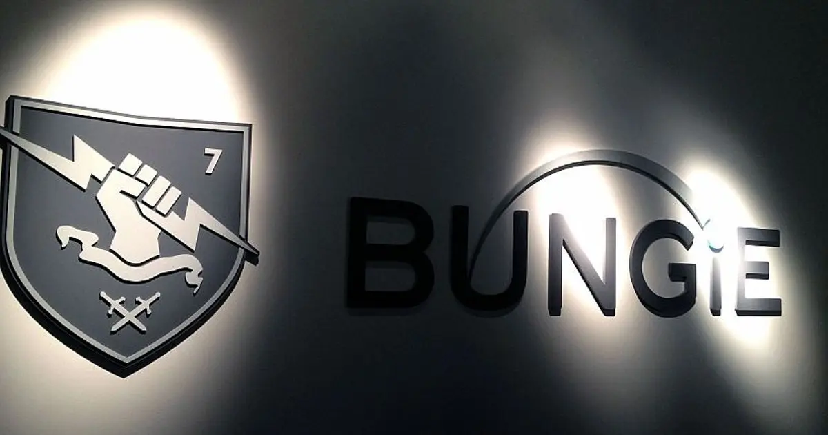 Bungie logo featuring a shield and a stylized fist, displayed in a studio setting.