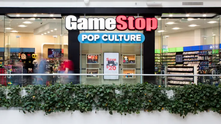 Exterior view of a GameStop store featuring video games and merchandise.