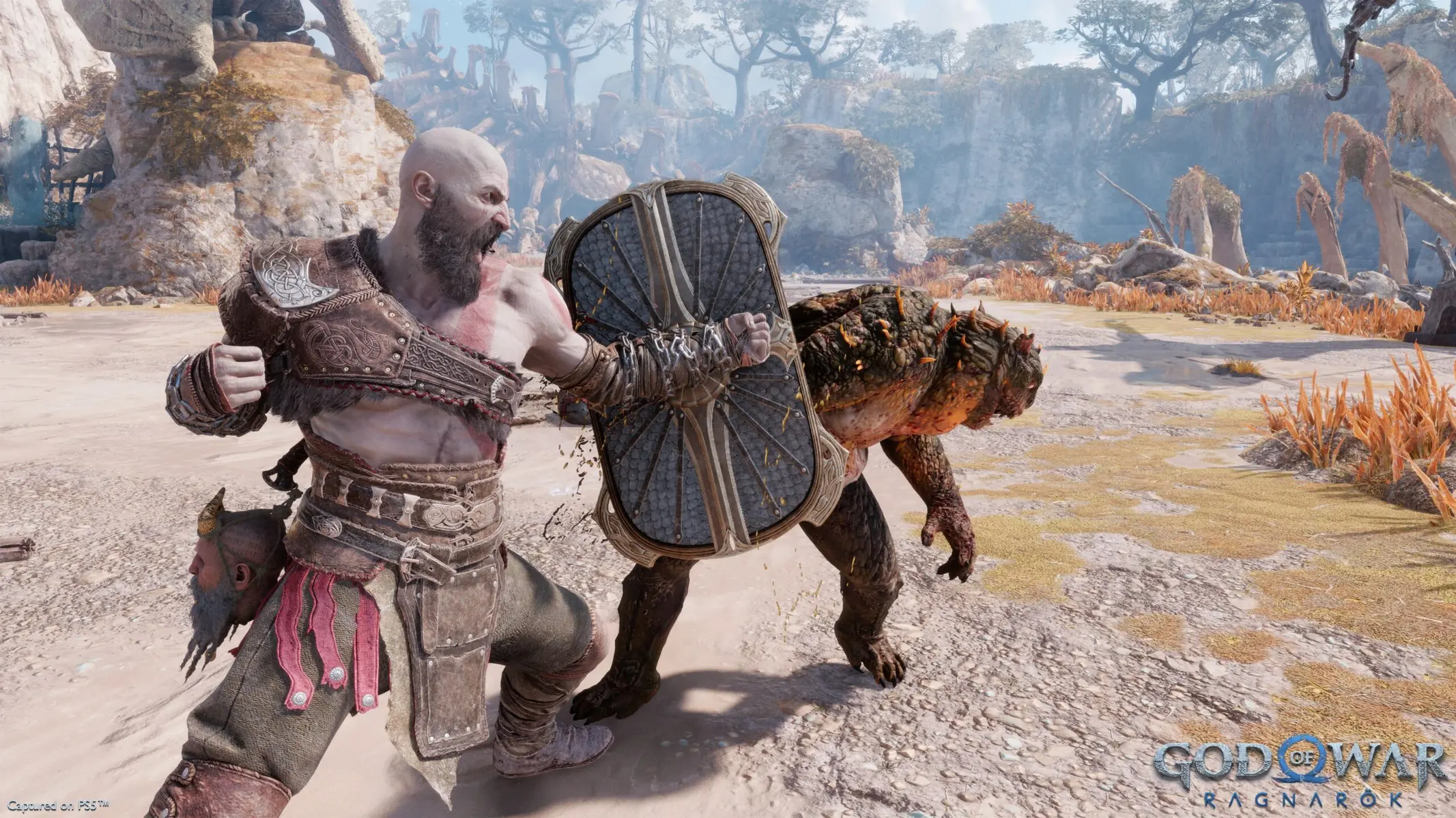 Kratos using his Guardian Shield to block an attack from a creature in God of War Ragnarok