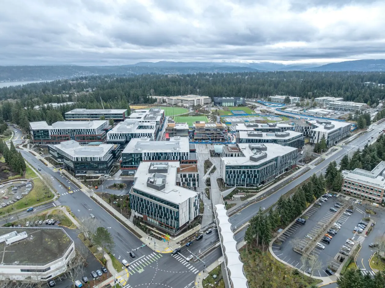 Aerial view of Microsoft's Redmond headquarters featuring modern office buildings and green spaces.