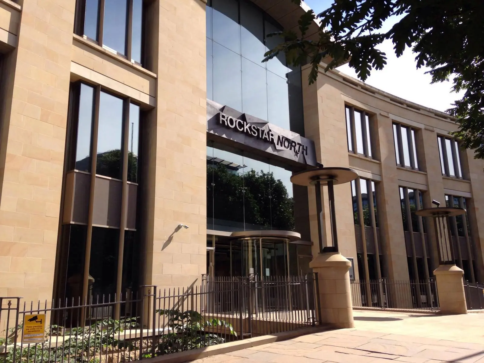 Exterior of the Rockstar North office building with the company sign above the entrance