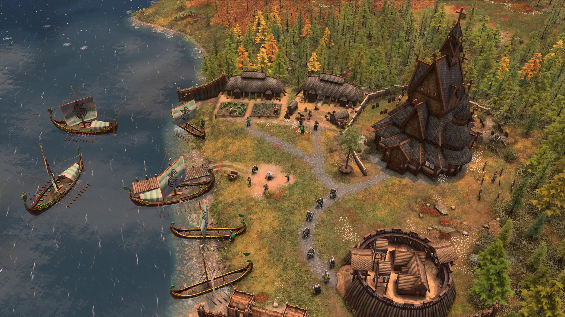 Age of Empires IV Viking settlement featuring longships, thatched-roof houses, and a large stave church.