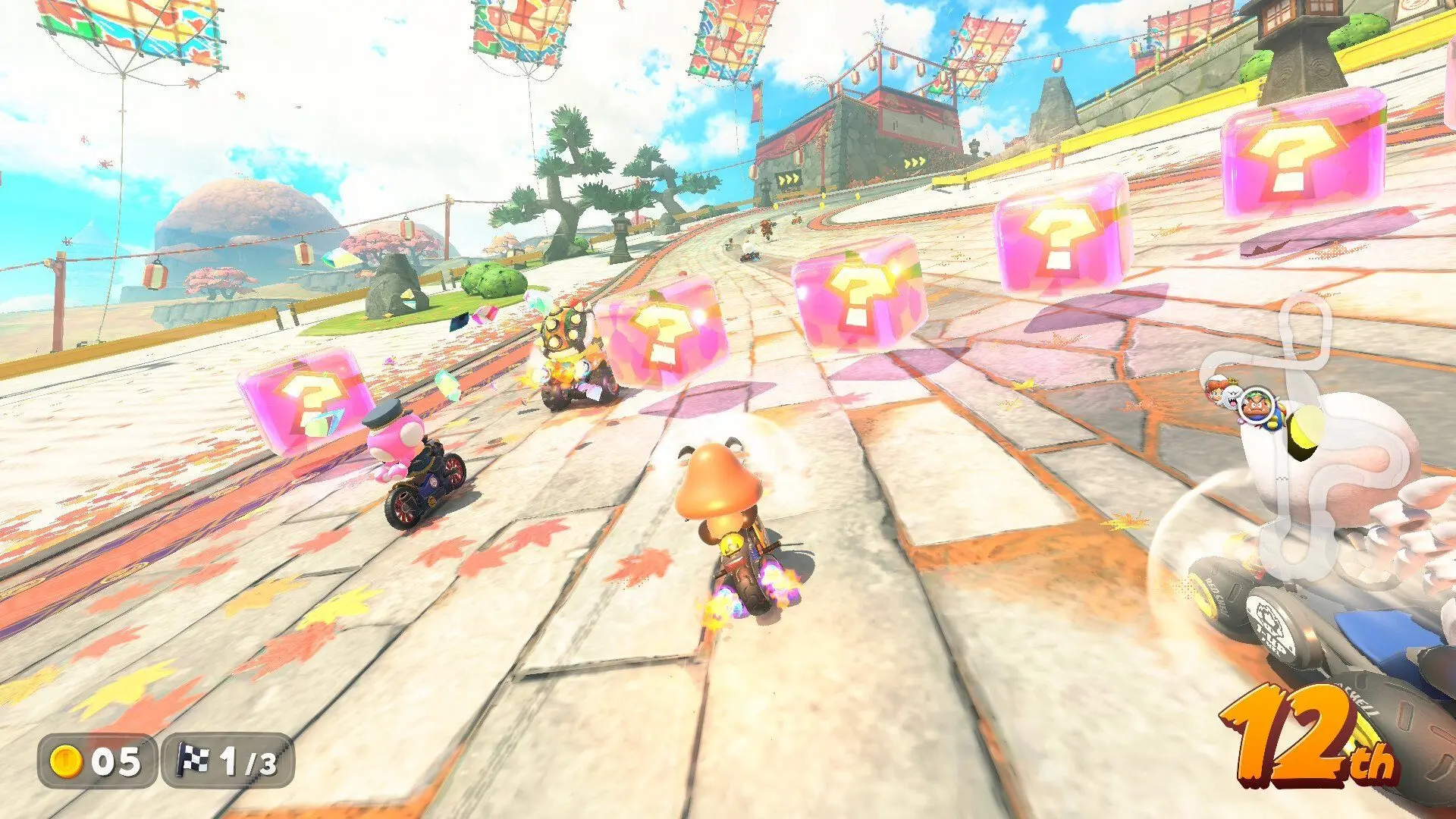 Mario Kart 8 Deluxe gameplay featuring Toad and Toadette racing through a Japanese-themed course with item boxes.