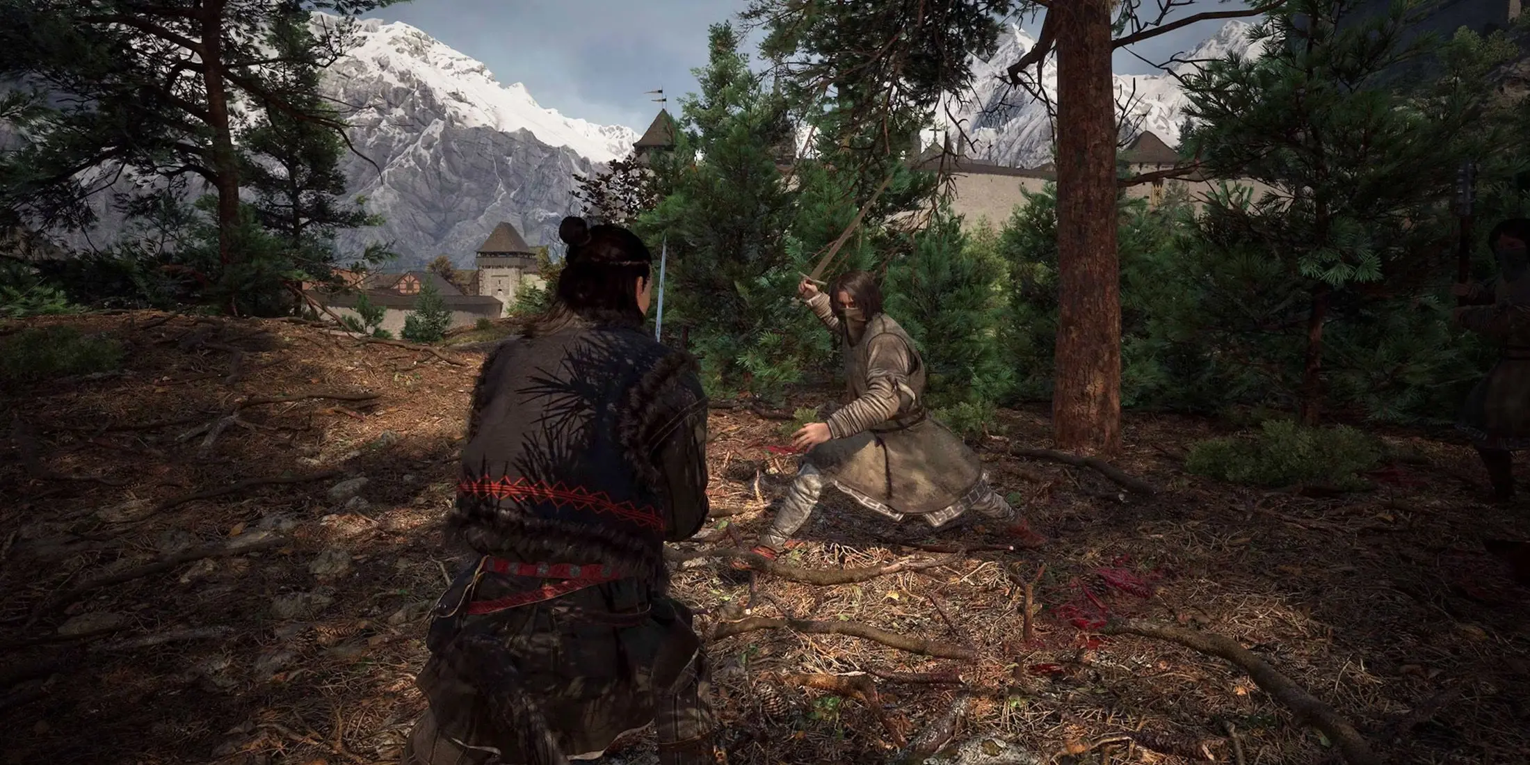 Third-person gameplay view of two warriors fighting with swords in a snowy mountain forest near a stone fortress.