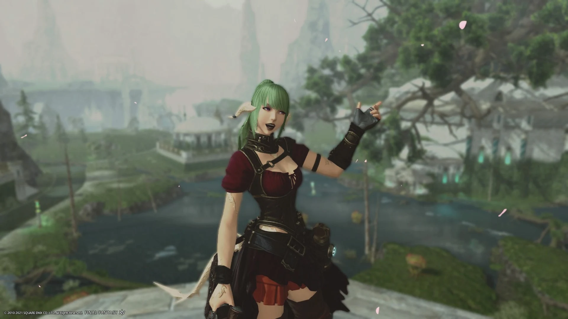 A green-haired female character in dark fantasy attire posing in a lush, mountainous landscape in Final Fantasy XIV.